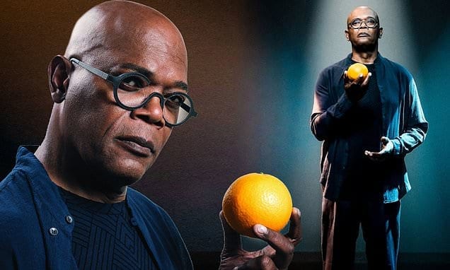 Samuel L Jackson holding an orange